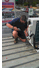 fridge mechanic working hard